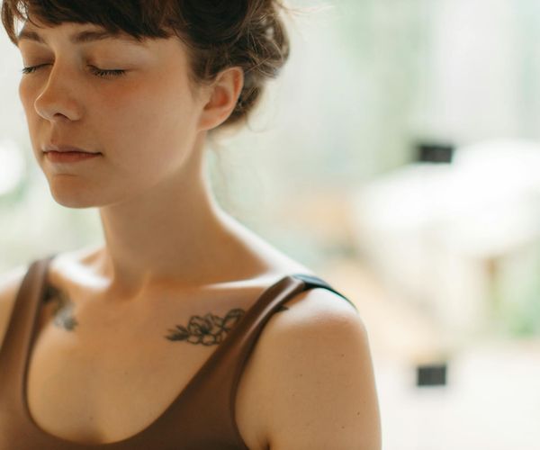 A person balancing in a calm, minimalist environment.